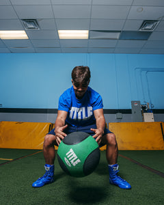 TITLE Boxing Rubber Medicine Balls guy throwing down ball