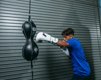 variant:lifestyle::TITLE Boxing Mexican Style 2-N-1 Double Eng Bag kid hitting double end bag 