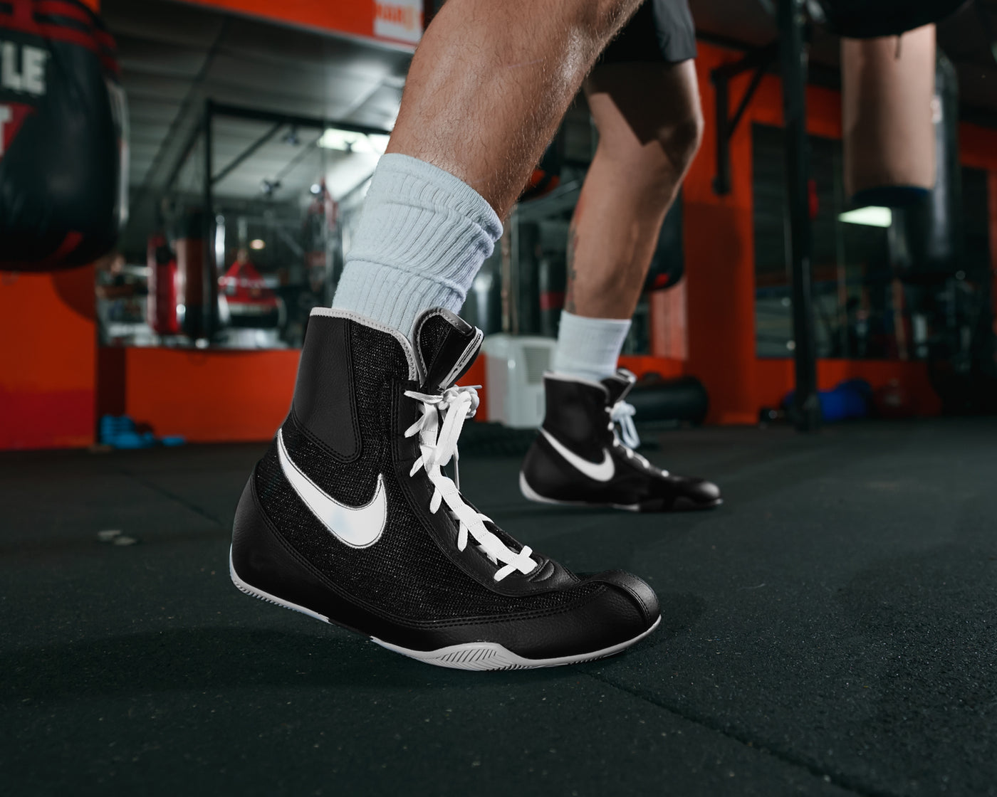 variant:Black/White::Nike Boxing Shoes Machomai 2 close up on shoe