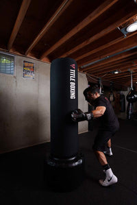 variant:white/black::Nike Shoes Machomai 2 guy punching a bag