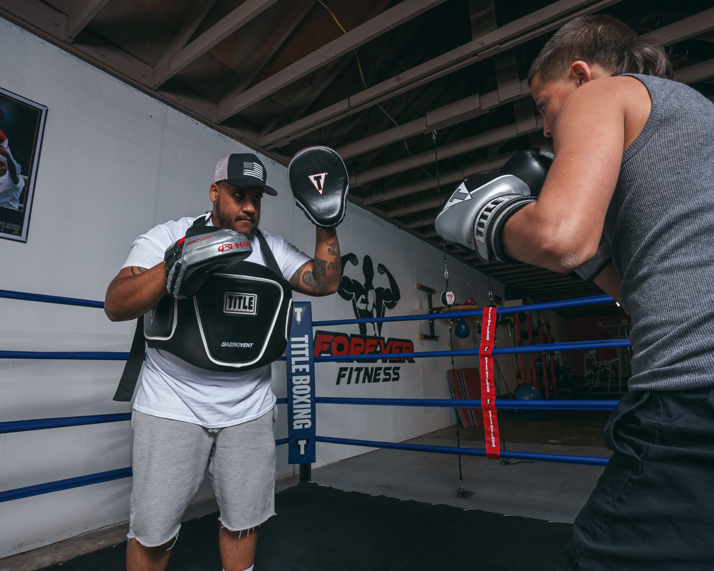 variant:lifestyle::TITLE Boxing Aerovent Elite Body Protector coach with boxer