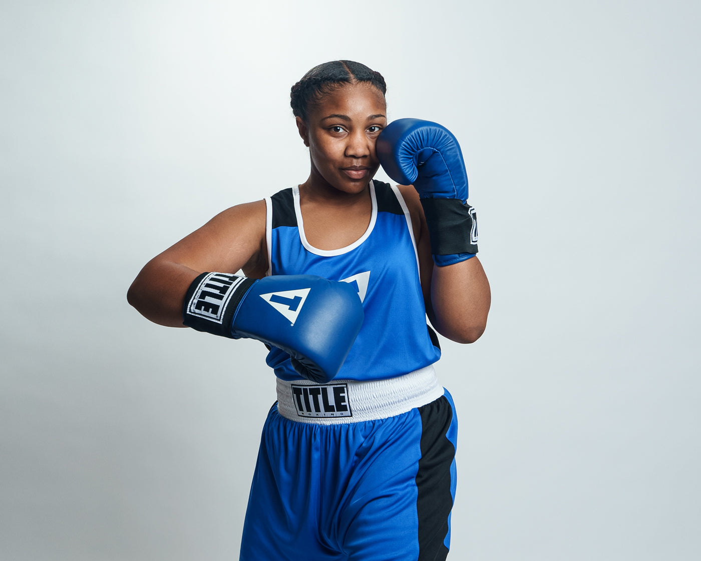 variant:blue::TITLE Boxing USA Boxing Competition Gloves girl boxing stance