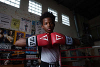 variant:red::TITLE Boxing USA Boxing Competition Gloves hands together
