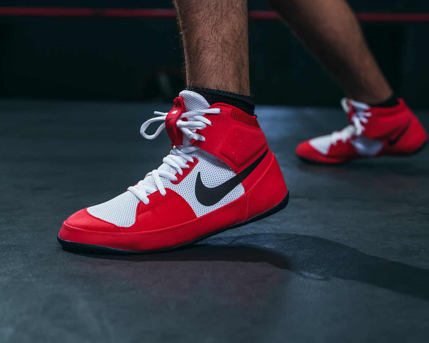 variant:Red/White/Black::Nike Fury Boots feet on ground