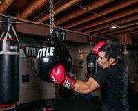 variant:lifestyle::TITLE Boxing Aqua Training Punch Bag guy throwing hook