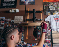 variant:lifestyle::TITLE Boxing adjustable speed bag platform guy hitting speed bag platform adjusting