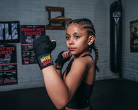 variant:Black::BOOM BOOM Boxing Youth Flex Hand Wraps kid girl boxing pose