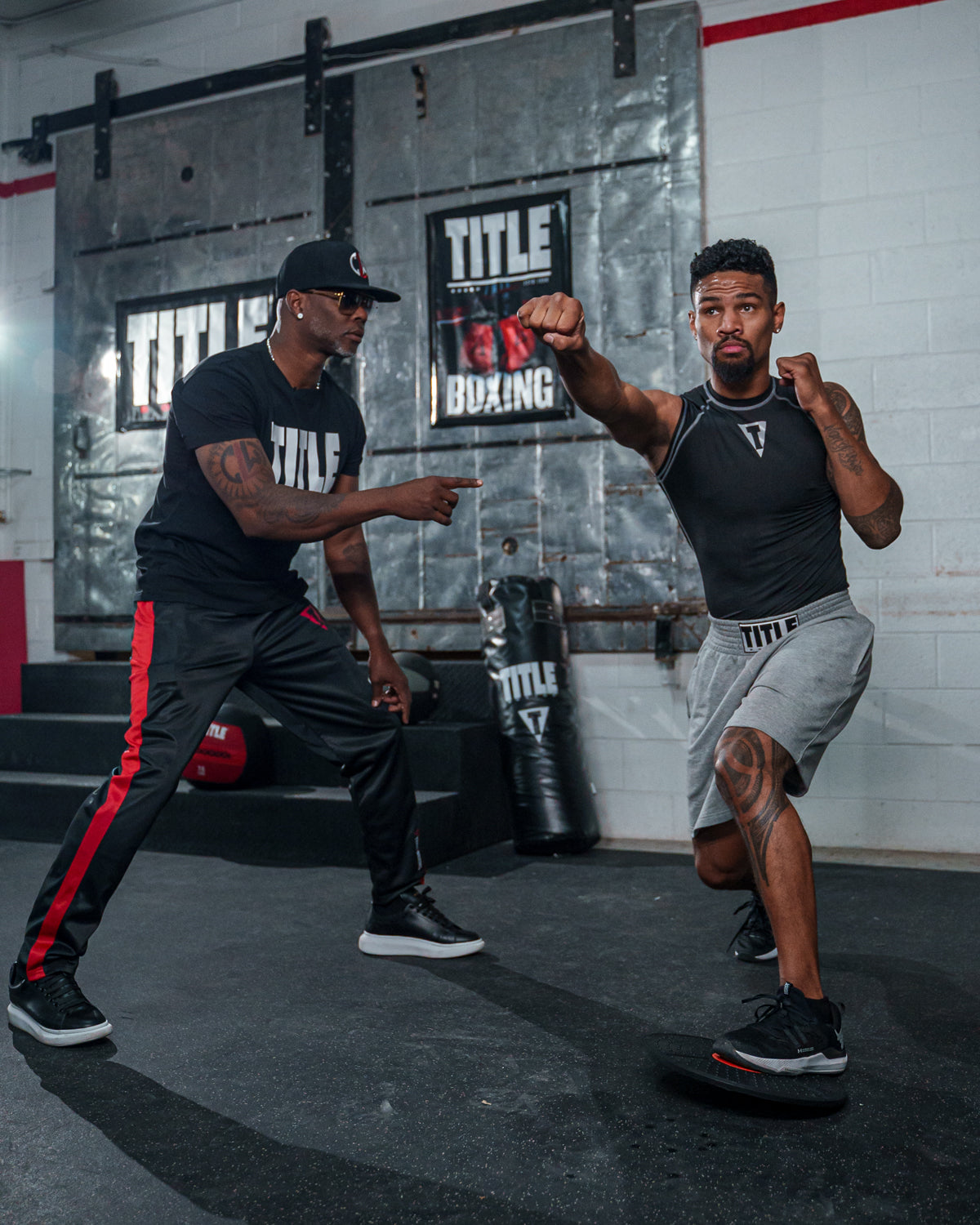 Boxers training using TITLE Boxing balance board