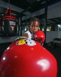 variant:Red/Black/White::BOOM BOOM Boxing Silencer youth bag gloves close up on glove