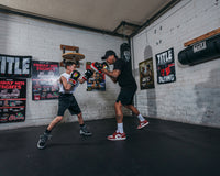 variant:lifestyle:: BOOM BOOM Boxing Silencer Youth Training Set mitting with trainer