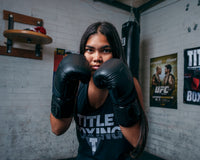variant:lifestyle::TITLE Black Blitz Fit Boxing Gloves girl boxing stance