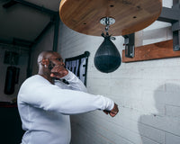variant:lifestyle::TITLE Black Speed Bag 2.0 guy hitting speed bag