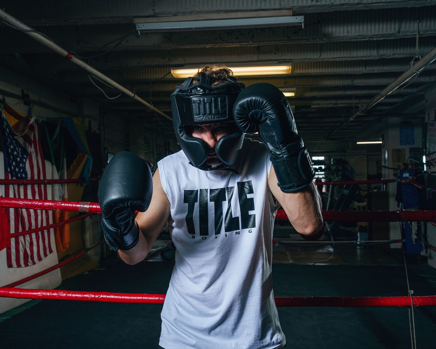 variant:lifestyle::TITLE Black Training Headgear  guy hands up 