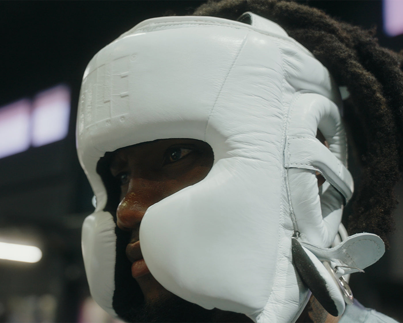 variant:black::TITLE Boxing Pro Sparring Headgear closeup on boxer's head side view