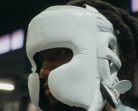variant:black::TITLE Boxing Pro Sparring Headgear closeup on boxer's head side view