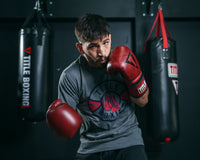 variant:lifestyle::TITLE Boxing Blood Red Leather Bag Gloves boxing pose