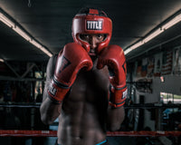 variant:lifestyle::TITLE Boxing Blood Red Headgear and Sparring Gloves Bundle on boxer view