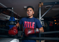 variant:lifestyle::TITLE Boxing Blood Red Leather Training Gloves kid on boxing ropes