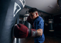 variant:lifestyle::TITLE Boxing Blood Red Leather Training Gloves kid left jab bag