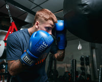 variant:blue::TITLE Boxing Peak Training Boxing Gloves in the gym
