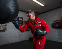 variant:black/blue::TITLE Classic Speed Boxing Gloves guy hitting bag