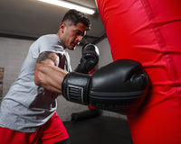 variant:black/grey::TITLE Classic Speed Boxing Gloves guy hitting bag