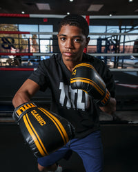 variant:black/gold::TITLE Classic Speed Boxing Gloves kid right hook