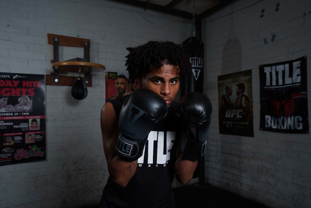 variant:Black/Dark Grey::TITLE Classic Crusade Boxing Gloves boxing pose