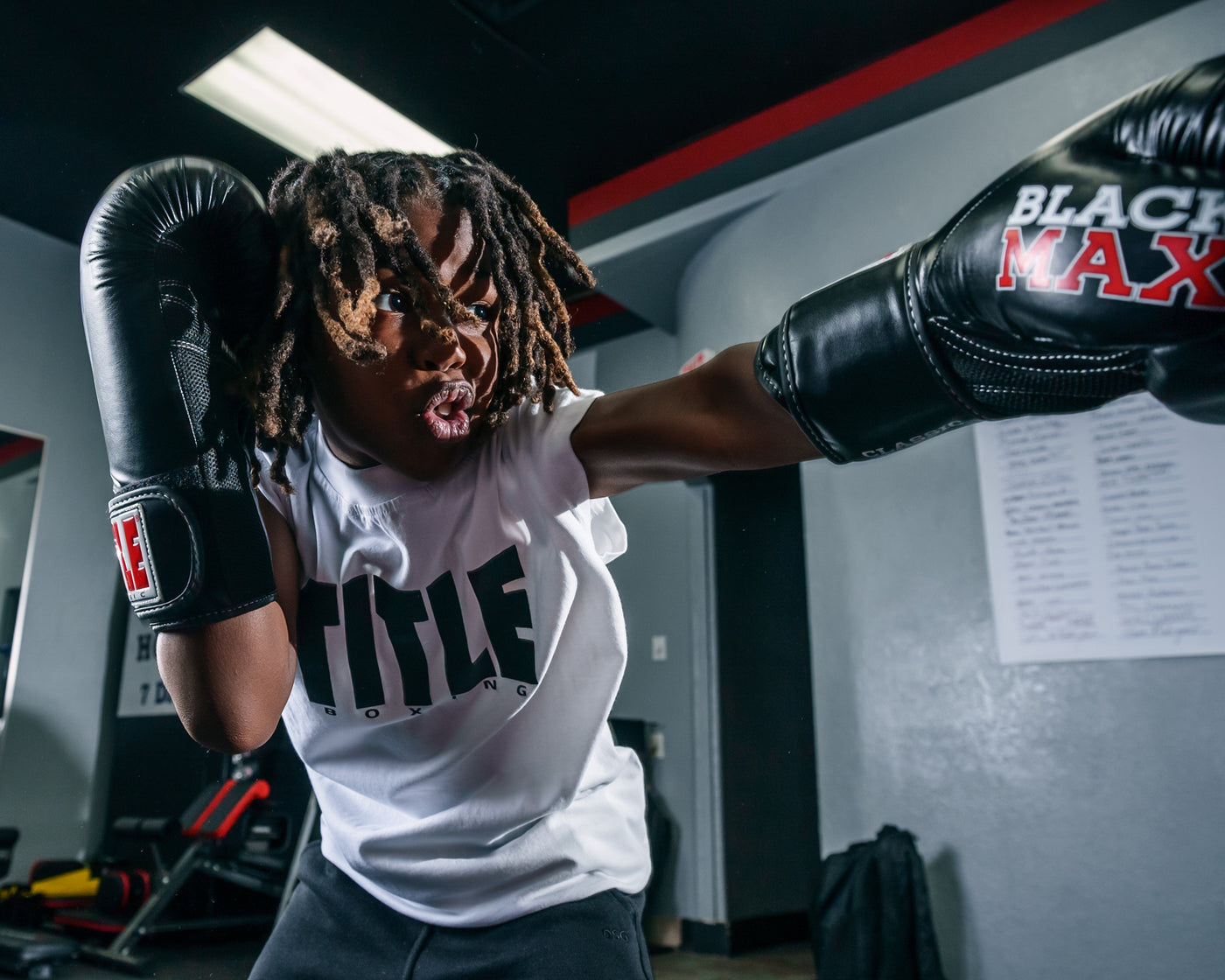 variant:lifestyle::TITLE Classic Black Max Boxing Gloves close up left jab