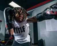 variant:lifestyle::TITLE Classic Black Max Boxing Gloves close up left jab