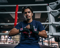 variant:lifestyle::TITLE Classic Traditonal Weave 180" hand wraps 2.0 guy sitting on ring