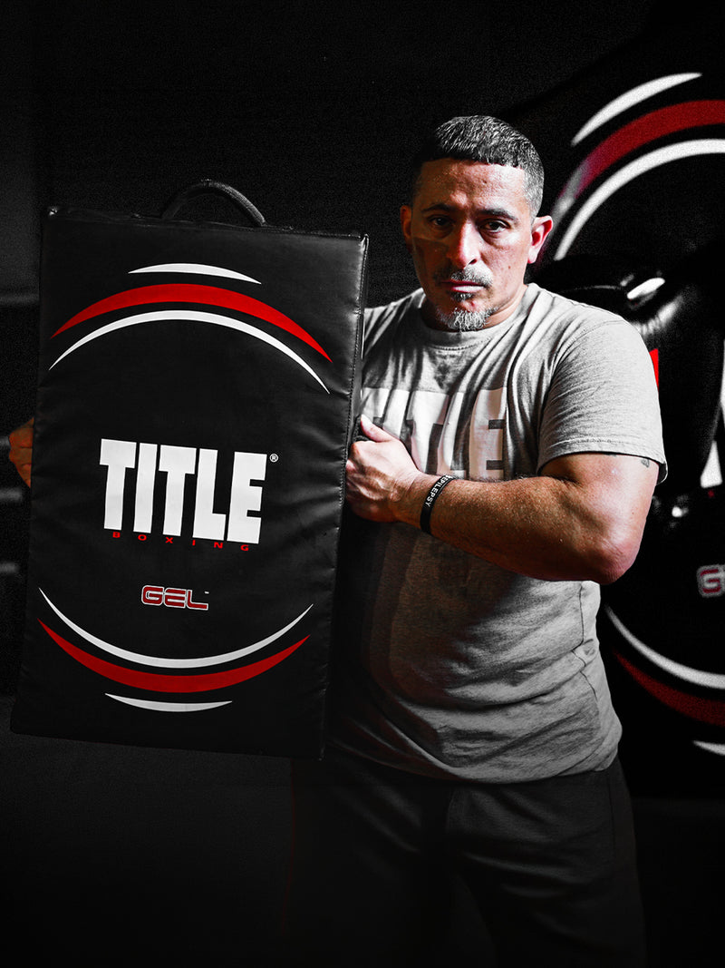 boxer holding gel punch shield