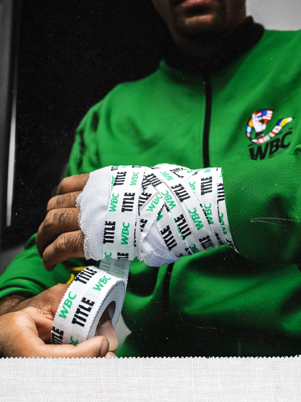 boxer applying tape over gauze