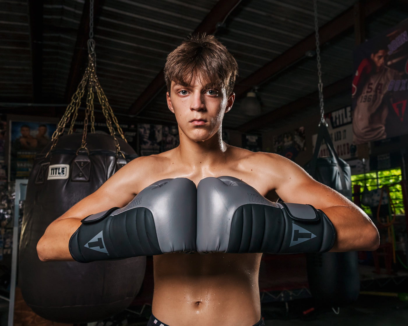 variant:Grey/Black::TITLE Boxing Combat Bag Gloves 2.0 Boy with knuckles touching