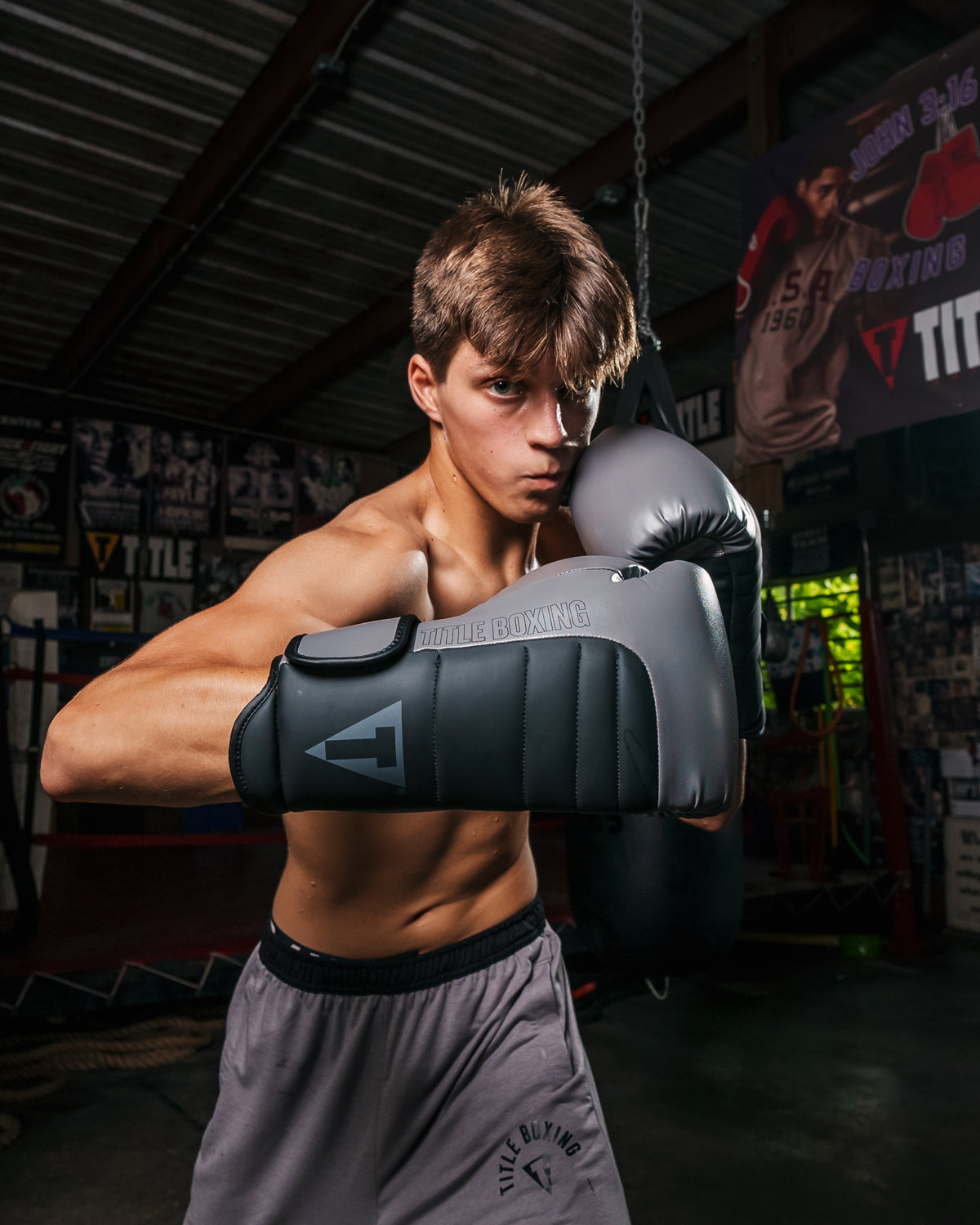 variant:Grey/Black::TITLE Boxing Combat Bag Gloves 2.0 Boy throwing a hook
