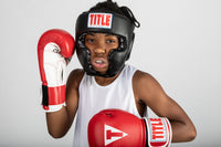 variant:lifestyle::TITLE Classic Boxing Sparring Bundle headgear on boxer
