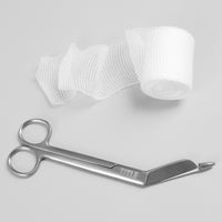 variant:lifestyle::TITLE Boxing Trainers Scissors laying flat next to gauze