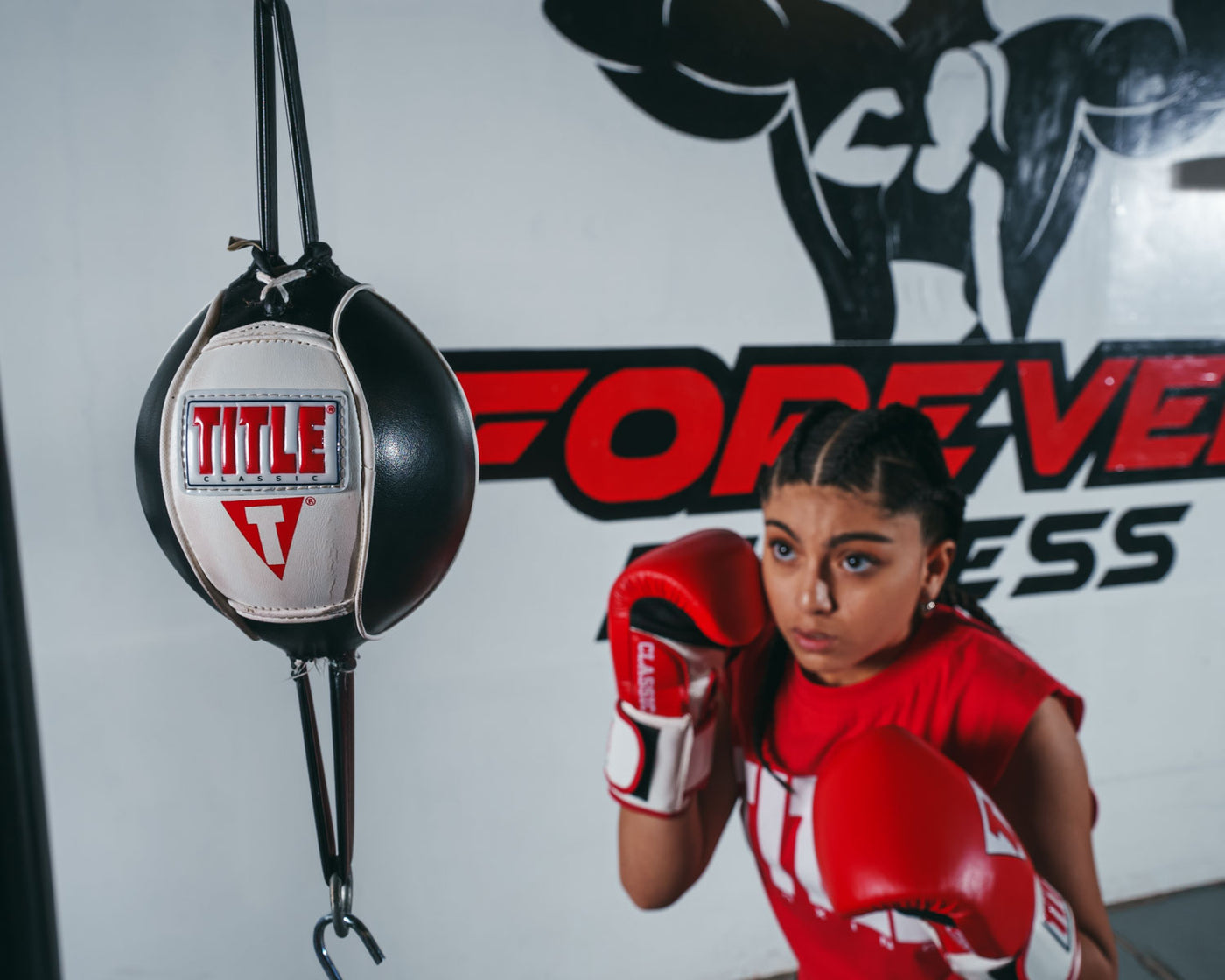 variant:red/white/black::TITLE Classic Leather Super Bag Gloves 2.0 girl hitting double end bag