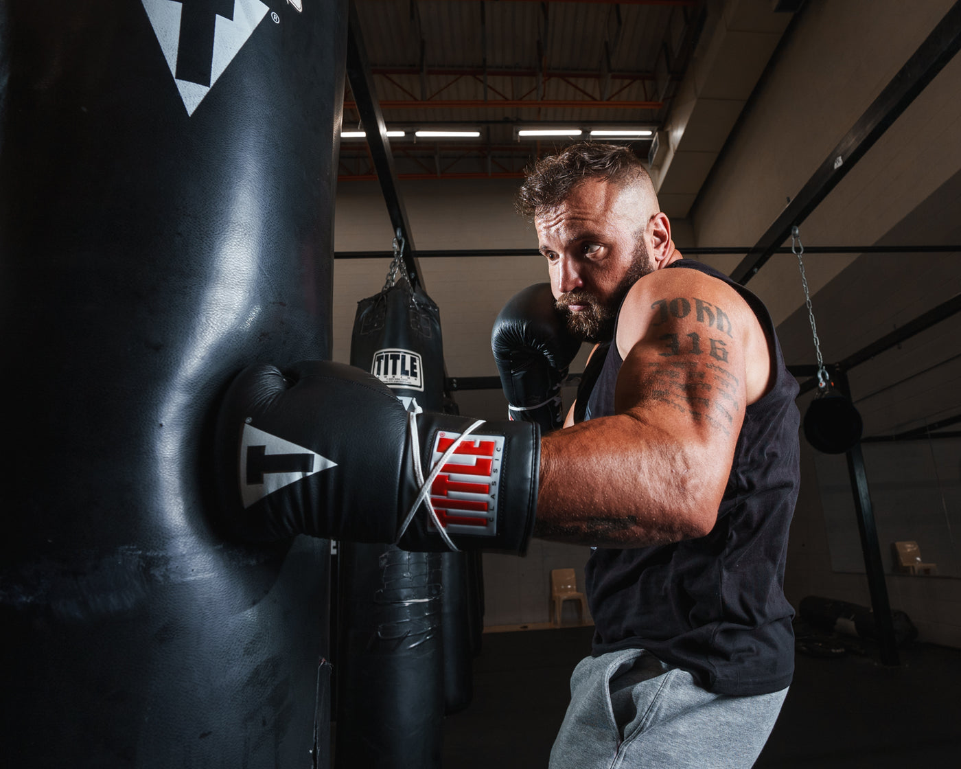 variant:black::TITLE Classic Leather Lace Training Gloves 2.0 guy left jab
