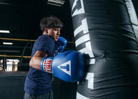 variant:blue::TITLE Classic Leather Lace Training Gloves 2.0 right hook on bag