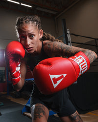 variant:red::TITLE Classic Leather Lace Training Gloves 2.0 girl boxing stance