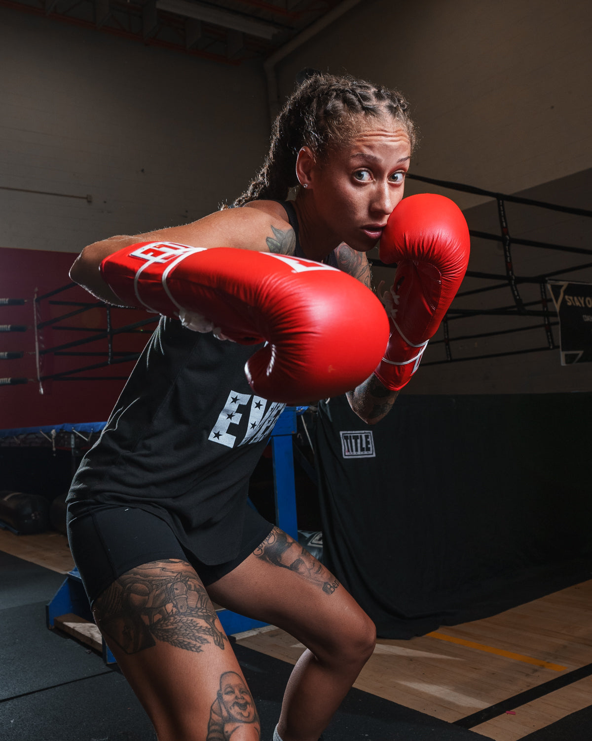 variant:red::TITLE Classic Leather Lace Training Gloves 2.0 girl boxing pose 