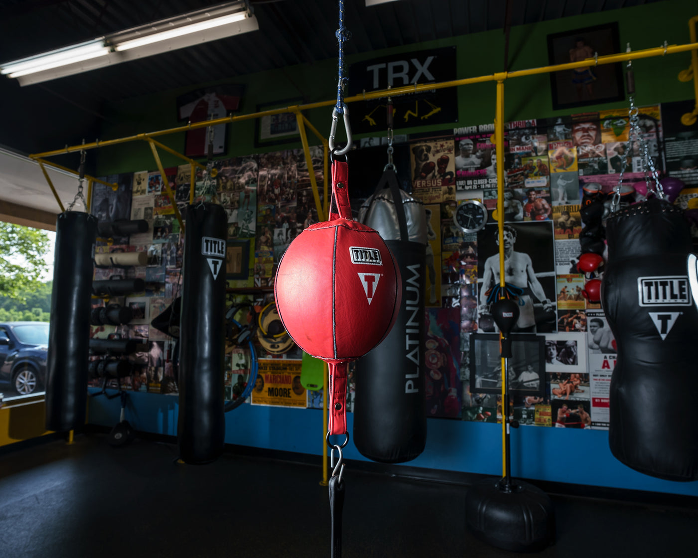 variant:7"::TITLE Boxing Double End Bag kid hitting double end bag