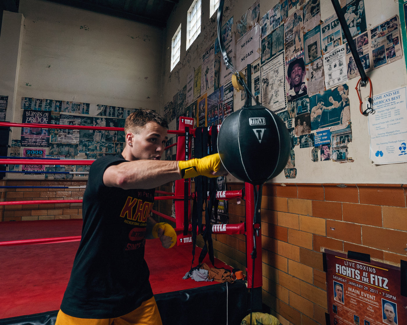 variant:9"::TITLE Boxing Double End Bag kid hitting double end bag showing from front end