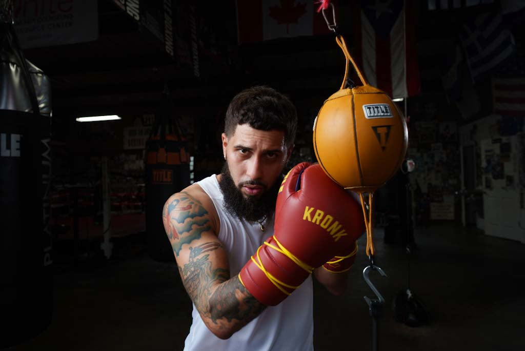 variant:6"::TITLE Boxing Double End Bag kid hitting double end bag with fighting gloves