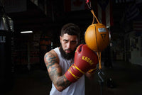 variant:6"::TITLE Boxing Double End Bag kid hitting double end bag with fighting gloves