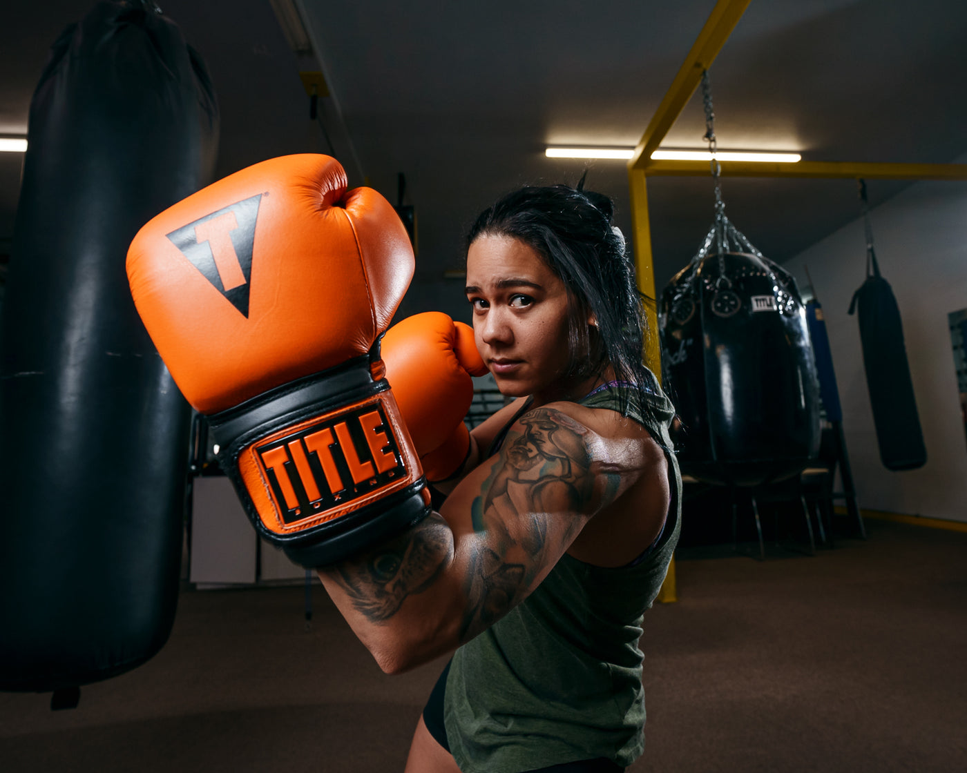 variant:orange/black::TITLE Boxing Dauntless Training Gloves left jab up