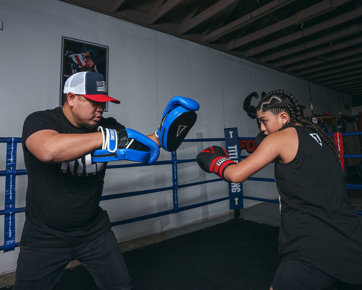 variant:lifestyle::TITLE Boxing Dual Purpose Combo Punch Mitts coach with boxer left jab
