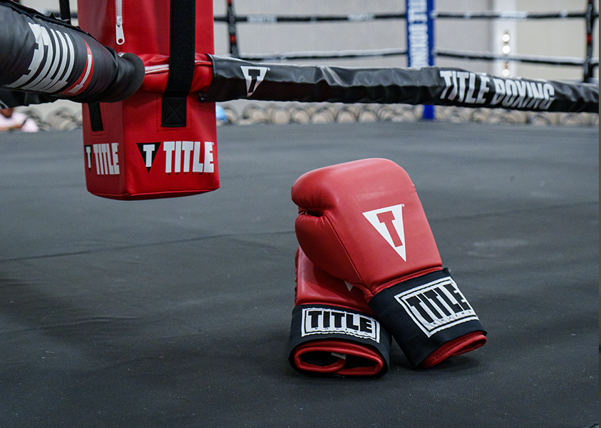 boxing gloves sitting in a boxing ring