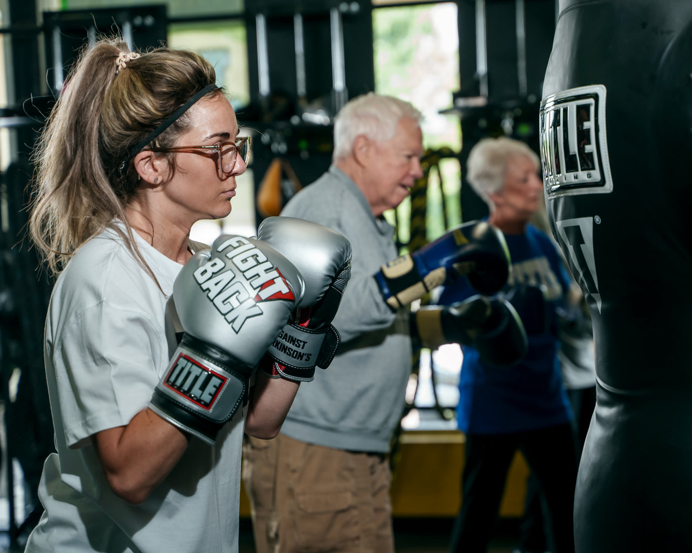 variant:lifestyle::TITLE Boxing Fight Back Boxing Gloves side view of class